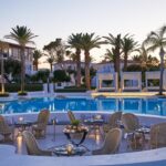 Grecotel Caramel Boutique Resort - Snack Bar by the Pool & a la carte Restaurant in the evening
