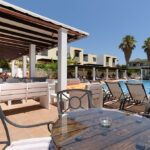 PefkosVillage - pool seating6707FD92 2A2D BFF6 C757 DA6A8B953CD5